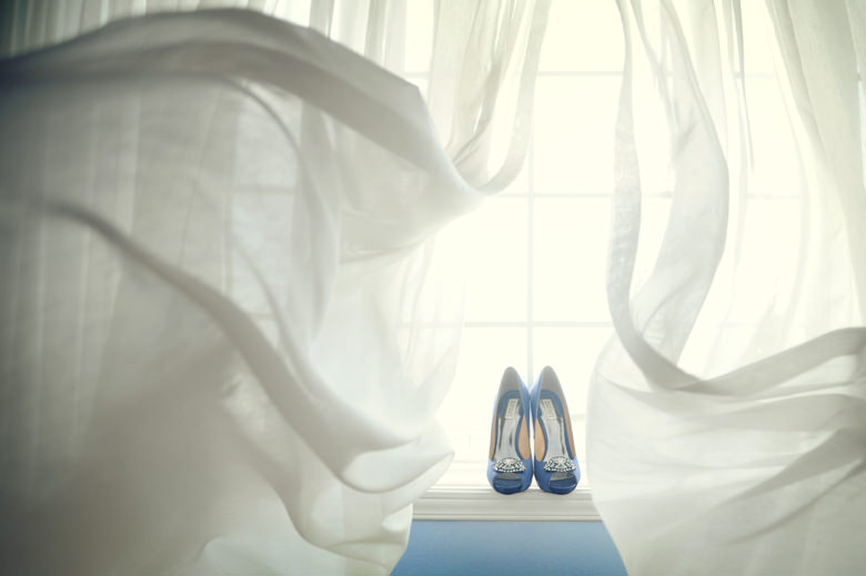Blue wedding shoes on the window award winning wedding photo by la V image Montreal wedding photographer