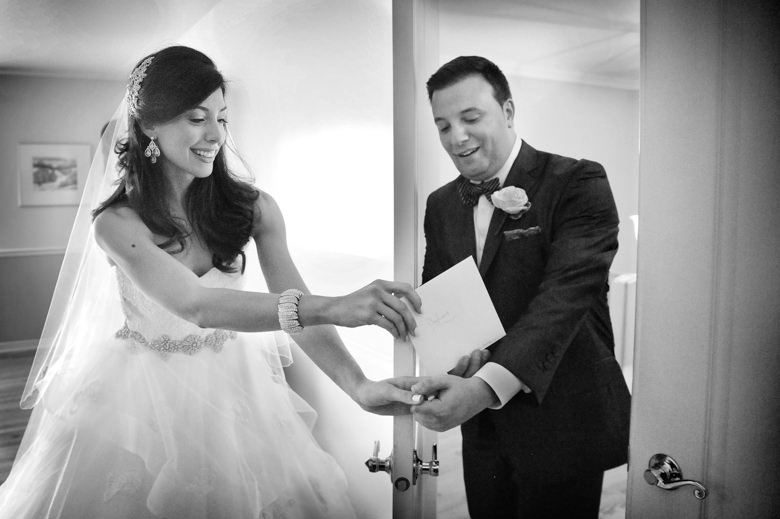 Bride and groom exchanging a letter through the door award winning wedding photo by la V image Montreal wedding photographer