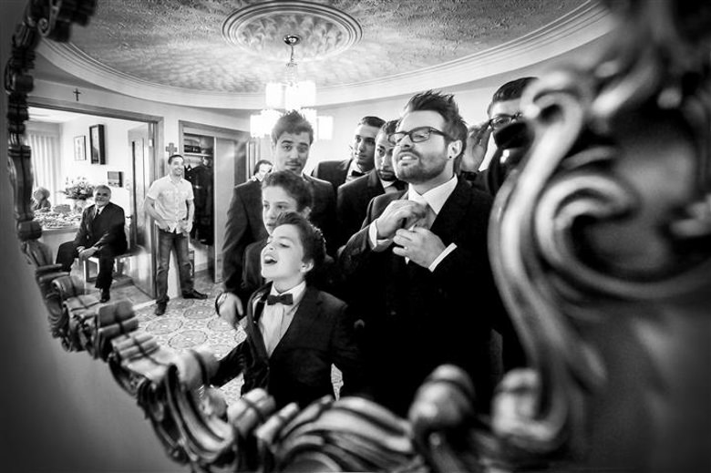 reflection in the mirror, groomsmen getting ready award winning wedding photos by la V image Montreal wedding photographer