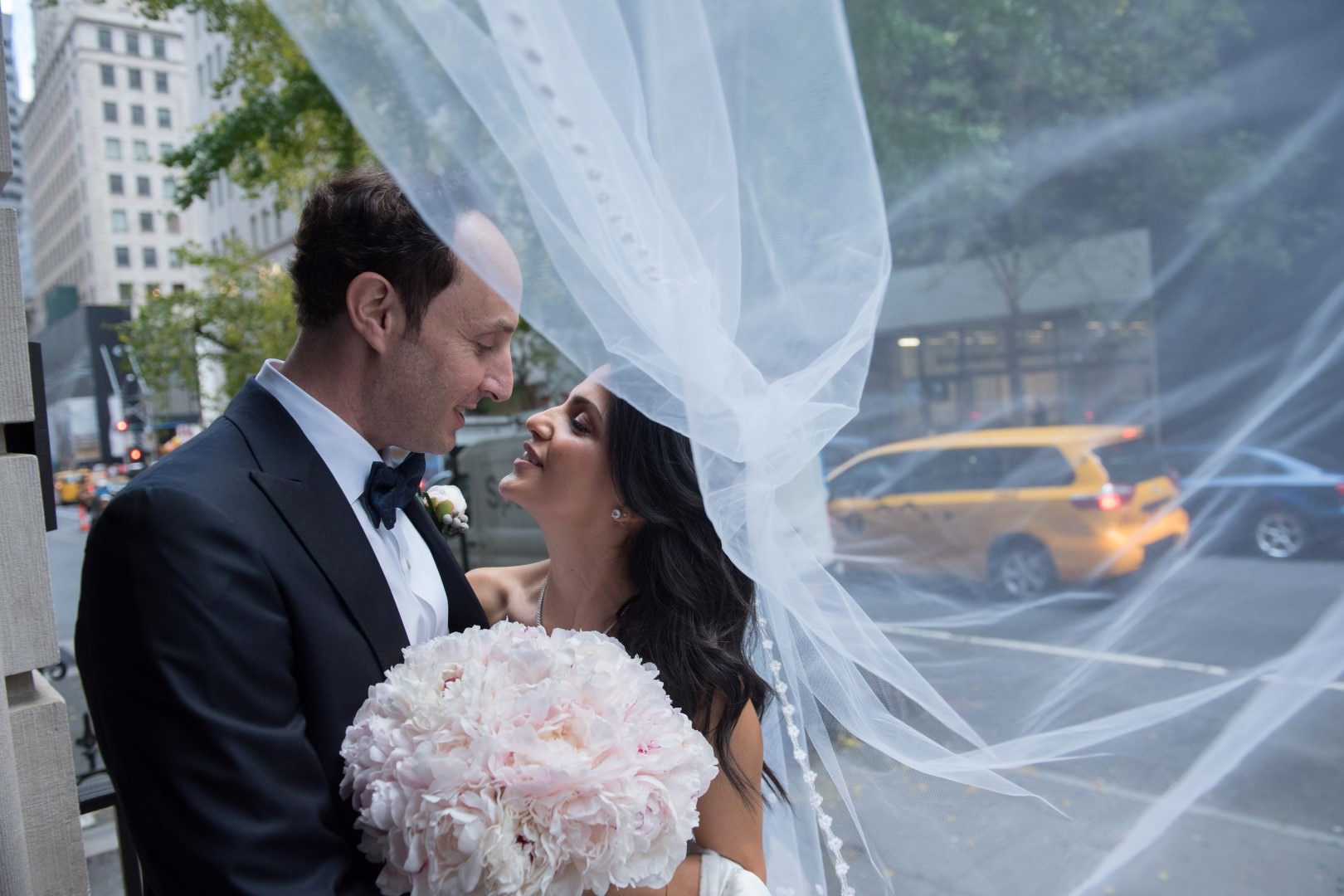 new york city artistic beautiful art wedding photography photographer photo groom bride emotional kiss walking street under veil wind